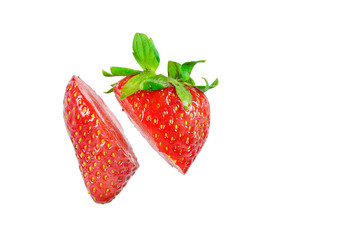 Strawberry cut in pieces isolated on a white background