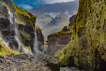 Cascades of white water from the glacier in Stakkholtsgja canyon
