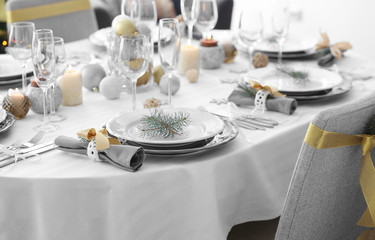 Table served for Christmas dinner in living room, close up view