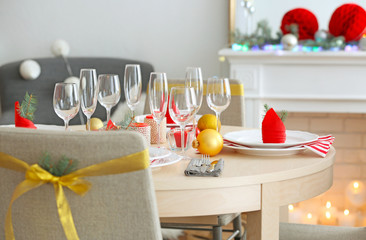 Table served for Christmas dinner in living room, close up view