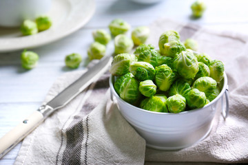 Brussels sprouts in small decorative bucket on napkin