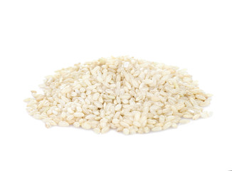 Pile of brown short grain rice isolated on white