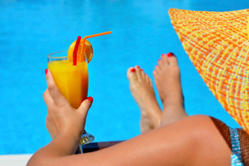 Real female beauty relaxing at swimming pool