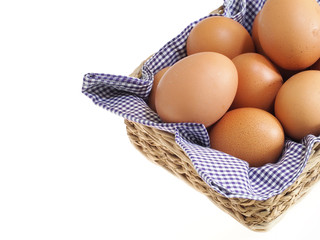 eggs in basket isolated on white background