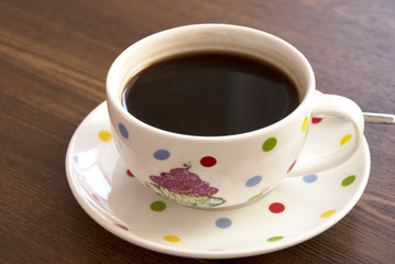 Coffee cup on the wooden table