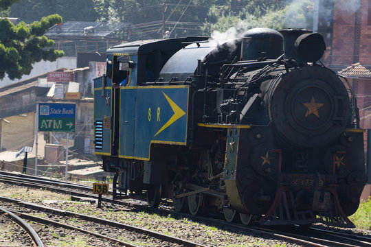 Nilgiri mountain railway. Blue train. Unesco heritage. Narrow-gauge. Steam locomotive in depot