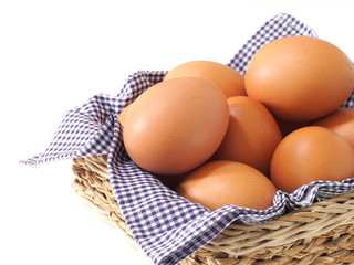 eggs in basket isolated on white background