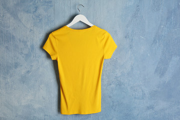 Blank yellow t-shirt on grunge background