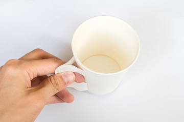 Hand hold on White paper Cup on white Background