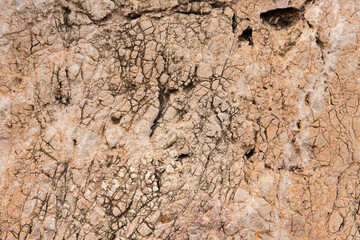 Background quarried rough textured limestone rock