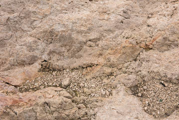 Background quarried rough textured limestone rock