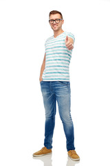 young smiling man in eyeglasses showing thumbs up