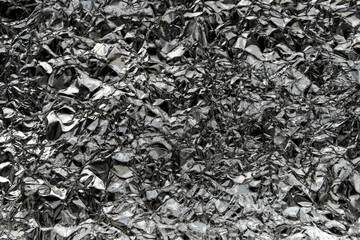 Crumpled wrinkled silver foil texture.Dark silver foil texture b