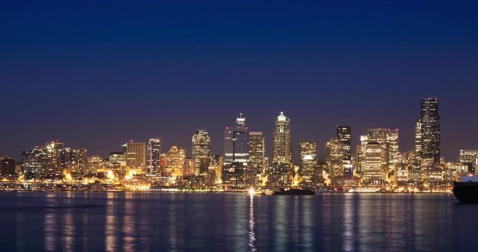 Seattle City Skyline at Sunset to Night. Panning view from West Seattle.