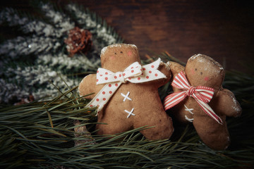 Christmas decoration. Gingerbread man, spruce branches. Studio shooting. Subject shooting.