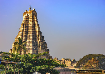 Virupaksha Temple, located in the ruins of ancient city Vijayanagar at Hampi, India. View from Hampi. It is part of the Group of Monuments at Hampi, designated a UNESCO World Heritage Site.