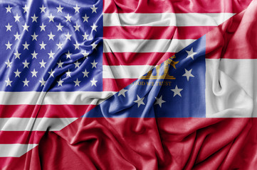 Ruffled waving United States of America and Georgia flag