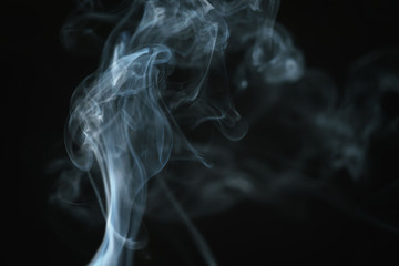 real blue smoke over black background, abstract backdrop