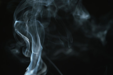 real blue smoke over black background, abstract backdrop