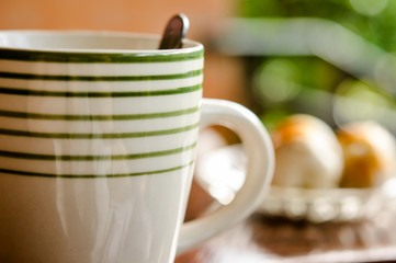 Cup of coffee and moon cake on a wooden table