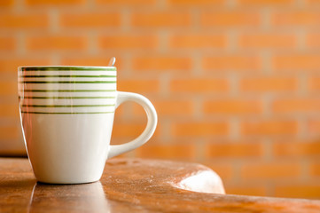 Cup of coffee on a wooden table