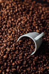 Two bronze cup full of coffee on the grains pile. Italian traditional morning short drink on breakfast. Close-up. Toned