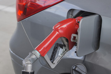 Fossil fuel pumping into vehicle