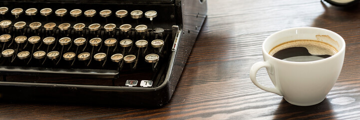 Coffee and typewriter on desk