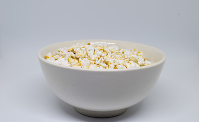 popped rice on white bowl and white background