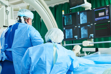 Interventional cardiology. Male surgeon doctor at operation