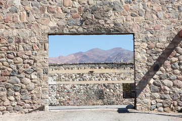 Wall rock window with mountain in background