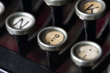 A close-up of question mark key on an old typewriter