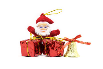 Santa Claus doll with gift box art objects for x mas days isolated on white background.