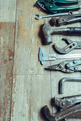 Working tools on wooden rustic background. top view