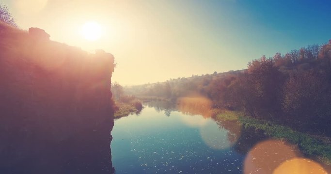 Aerial Drone Flight Footage: Picturesque view on Buky Canyon, Cherkasy region, Ukraine, Europe. Beautiful landscape in sunset glow with sun beams. Beauty world. 4K resolution.