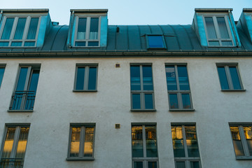 Fototapeta na wymiar modern building with blue and orange reflections in windows