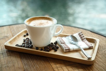 Cup of coffee on a wooden table.