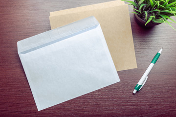 Photo of blank envelope on a  wooden background