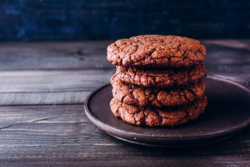 Homemade chocolate cookies on wooden table background. Food baking.  Copy space