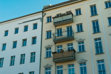 white and yellow facaded apartment houses at berlin