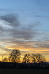Fototapeta na wymiar Wolken bei Sonnenuntergang Aufgang