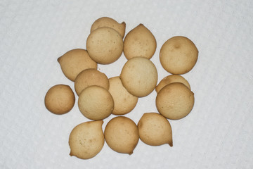 Biscuits and tea Cup on the background of napkins cotton
