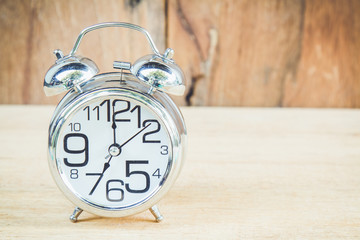 Clock on wood background