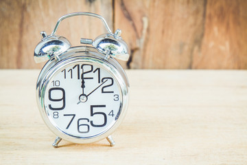 Clock on wood background