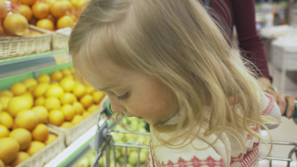 Family makes purchases in the supermarket
