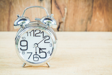 Clock on wood background