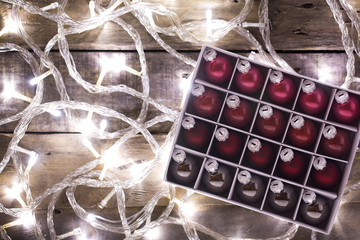 Christmas balls - different color Christmas balls on a light bulbs background