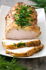 Roasted pork on wooden table
