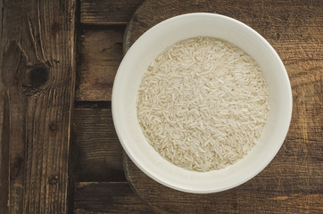 Rice in a plate. Ready for cooking. Healthy food.