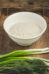 Rice in a plate with salad and greens. Ingredients for healthy